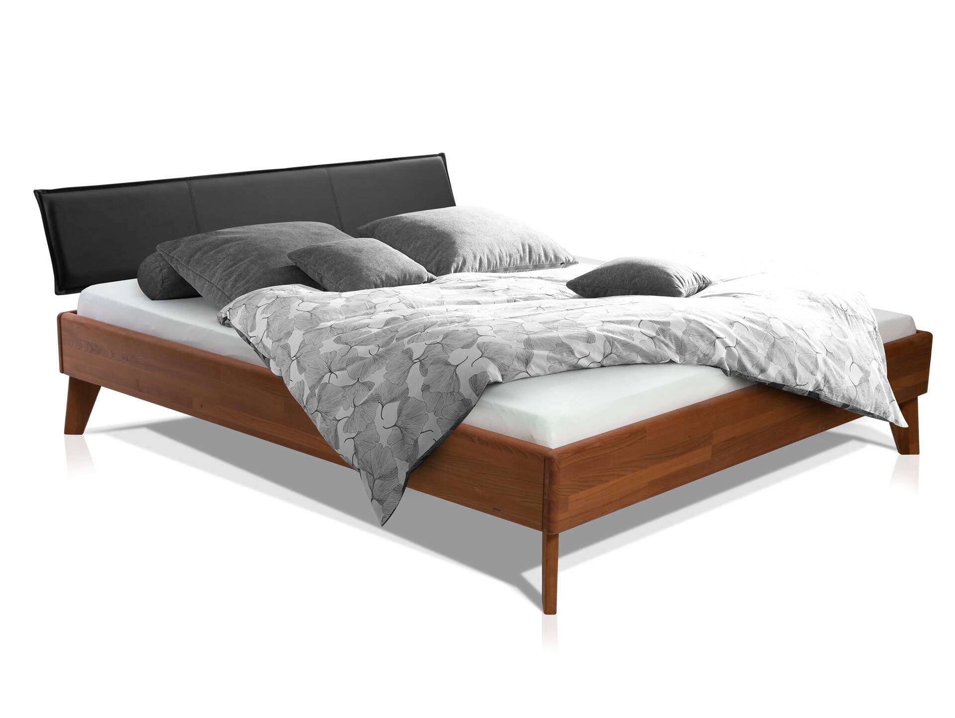 CALIDO 4-Fuß-Bett mit Polsterkopfteil, Material Massivholz 140 x 200 cm | Buche nussbaumfarbig gedämpft | Kunstleder Schwarz | Standardhöhe