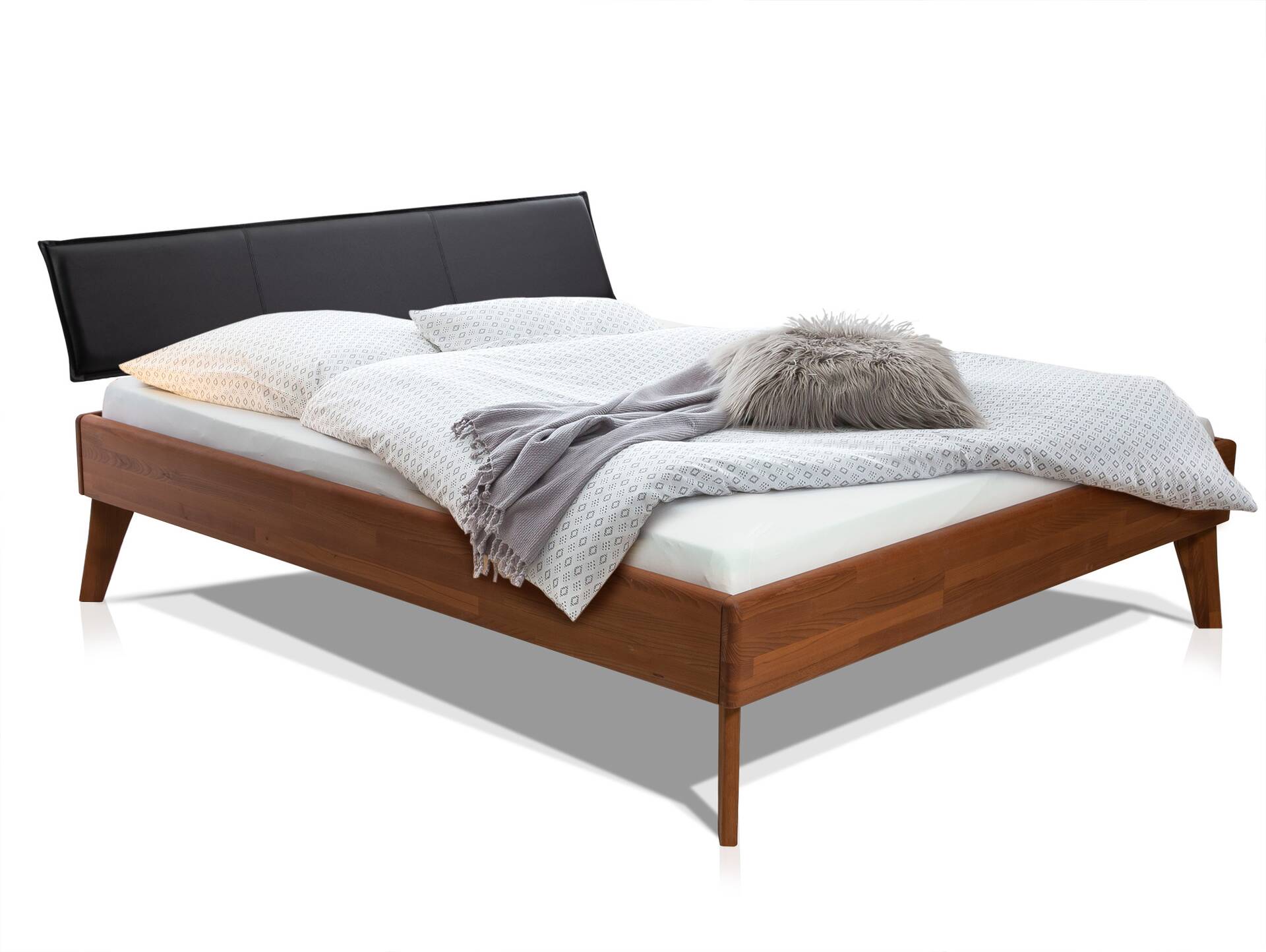 CALIDO 4-Fuß-Bett mit Polster-Kopfteil, Material Massivholz 120 x 220 cm | Buche nussbaumfarbig gedämpft | Kunstleder Schwarz | Komforthöhe