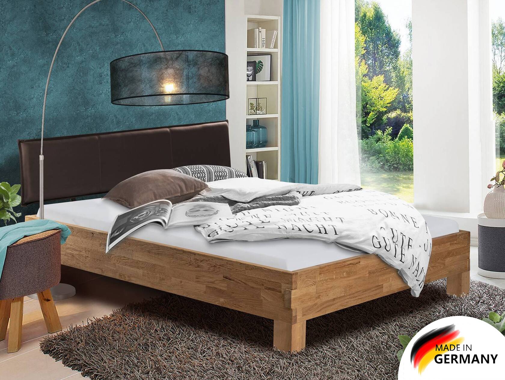 CORDINO 4-Fuß-Bett aus Eiche mit Polster-Kopfteil, Material Massivholz 200  x 220 cm | Eiche unbehandelt | Kunstleder Schwarz | gebürstet | Bettkopfteile
