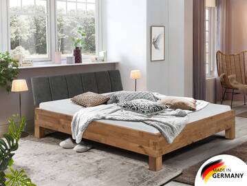 CORDINO 4-Fuß-Bett aus gebürsteter Eiche mit gestepptem Stoff-Kopfteil, Material Massivholz