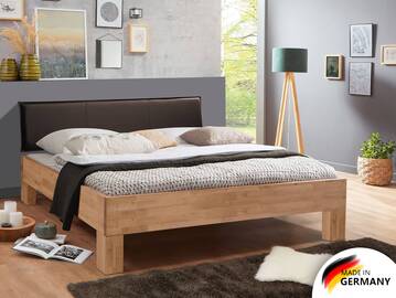LÖWEN 4-Fuß Massivholzbett mit Polsterkopfteil 