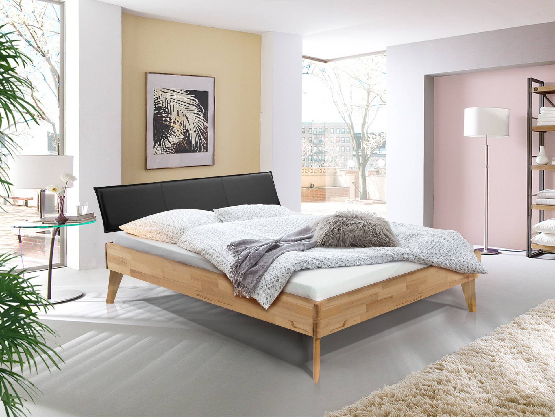 CALIDO 4-Fuß-Bett mit Polster-Kopfteil, Material Massivholz 180 x 220 cm | Eiche geölt | Kunstleder Schwarz | Komforthöhe