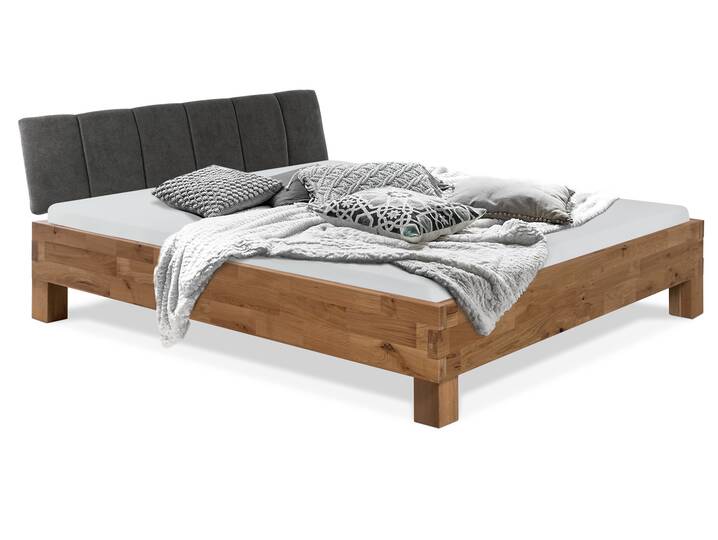 CORDINO 4-Fuß-Bett aus Eiche mit Polsterkopfteil, Material Massivholz 120 x 200 cm | Eiche unbehandelt | Stoff Anthrazit mit Steppung | gebürstet
